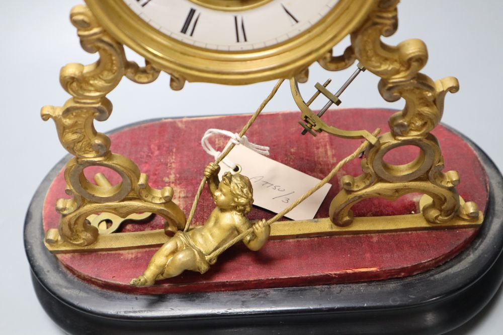 A 19th century French swinging cherub mantel timepiece under glass dome, French movement with exposed escapement, 35cm high